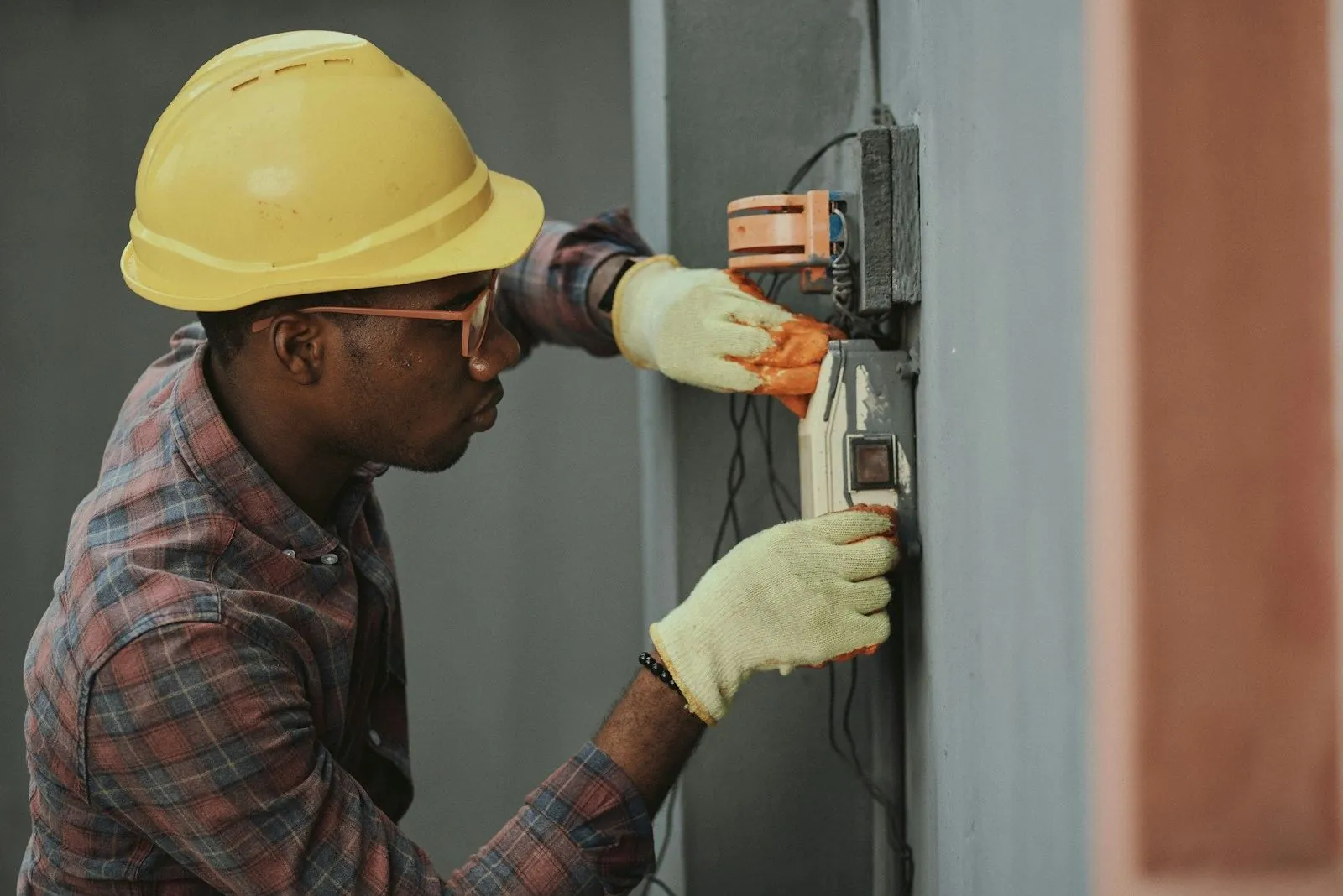 An electrician fitting a consumer unit